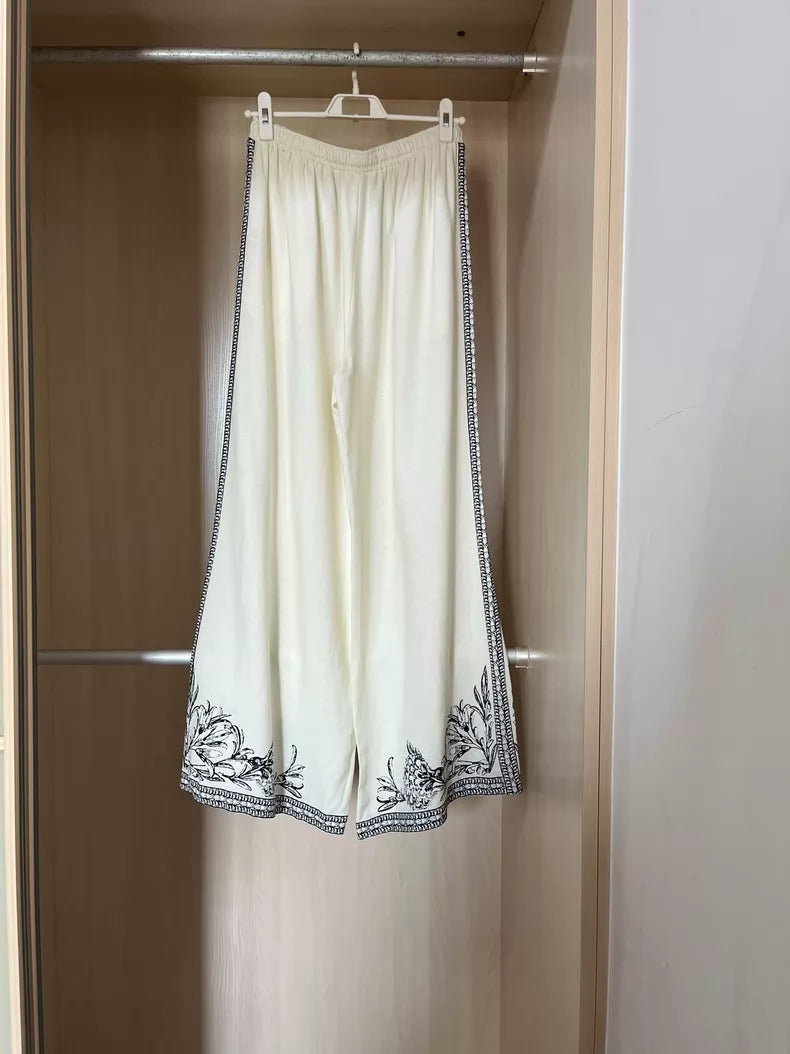 Floral-border trousers — fabric detail