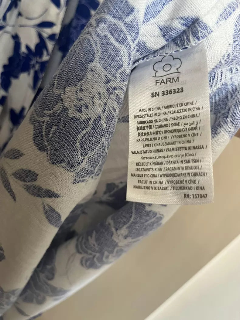 Cobalt botanical cotton midi dress — hem and lining detail