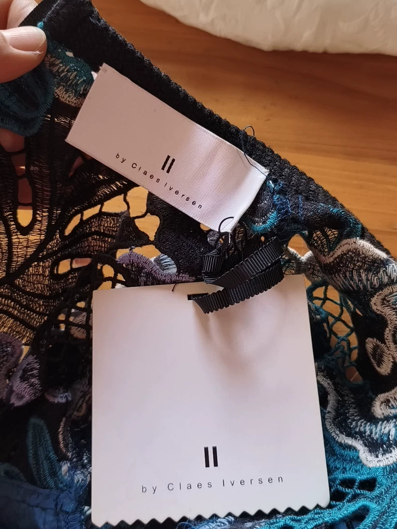 II by Claes Iversen dress — branded label detail