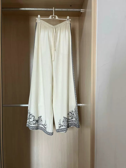 Ivory floral-border linen-blend wide-leg trousers — clean full view