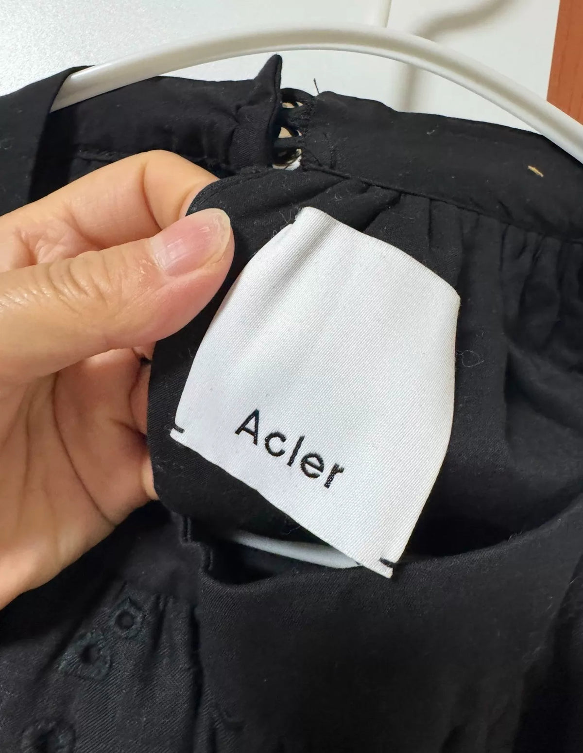 Acler black embroidered jumpsuit — brand label