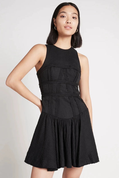 Black tiered mini dress — model back view