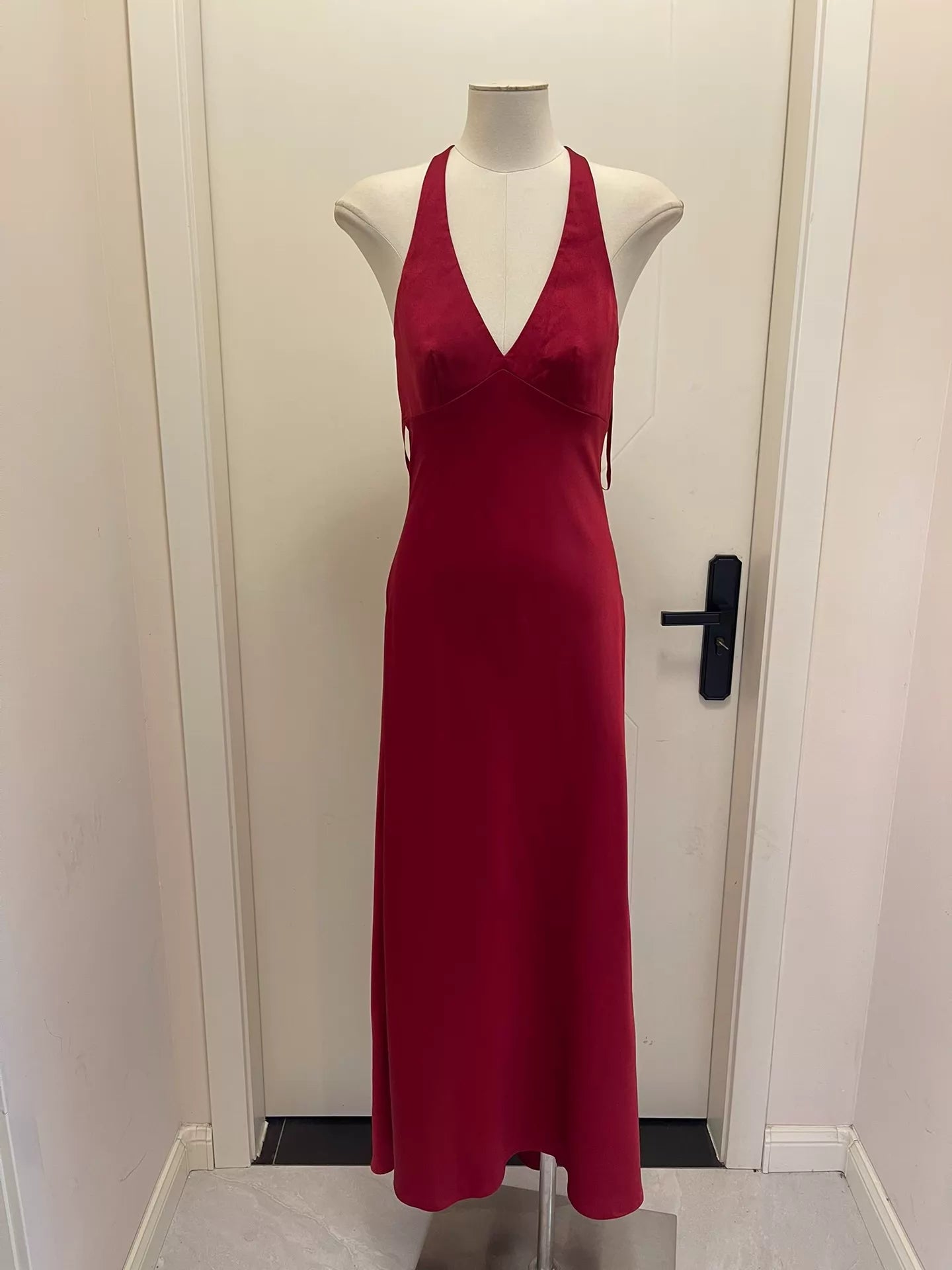 BCBGMAXAZRIA burgundy satin halter gown — front view