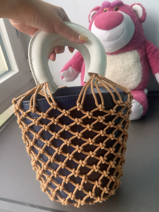 STAUD Woven Leather Handbag — front view