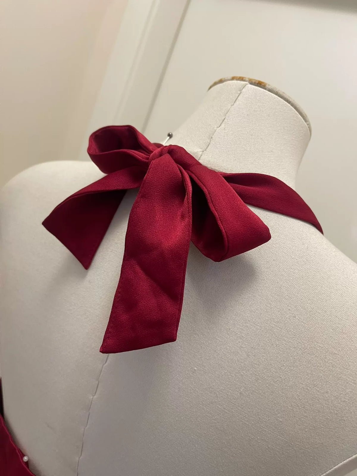 BCBGMAXAZRIA burgundy satin gown — construction detail