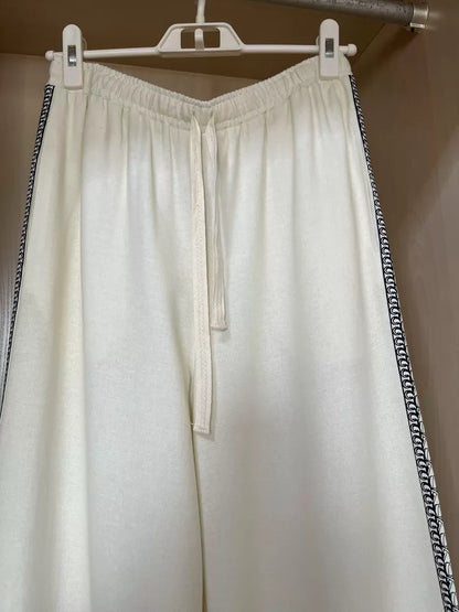 Floral-border trousers — hanging front view