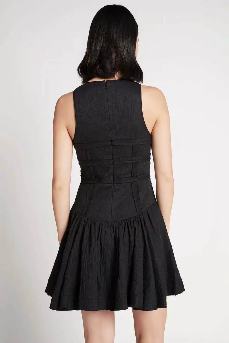Black tiered mini dress — seam detail