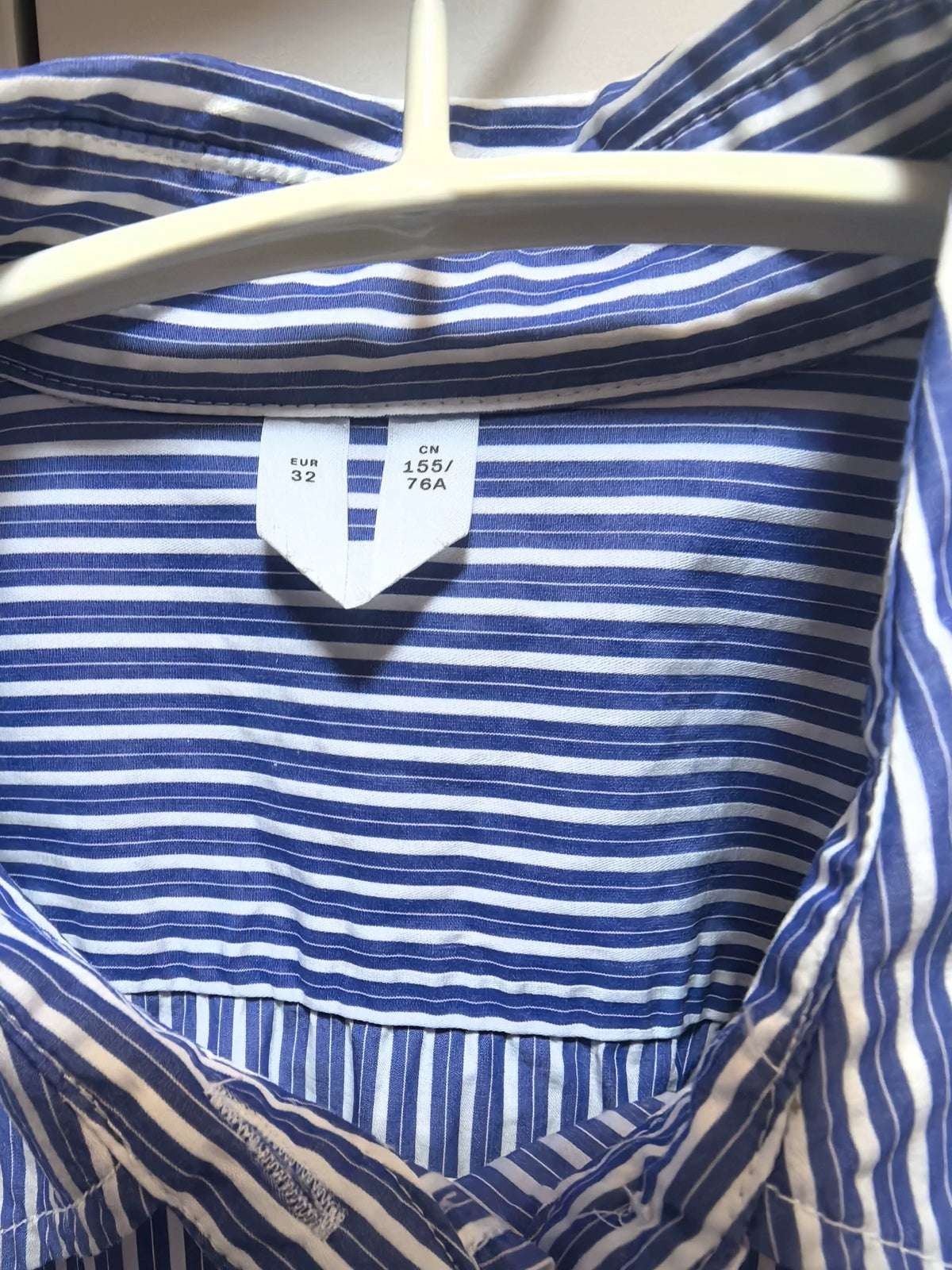 EU 32 size label and blue striped cotton fabric