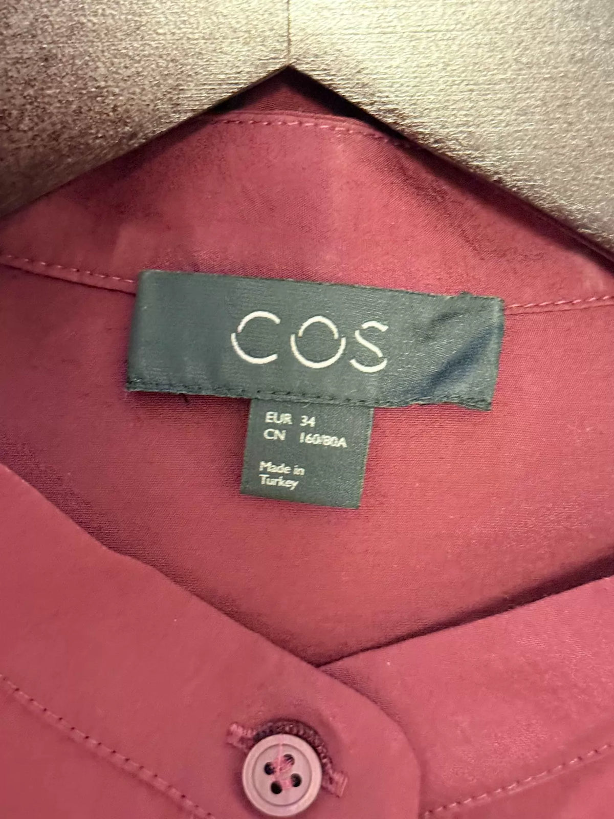 COS EU 34 label on burgundy dress