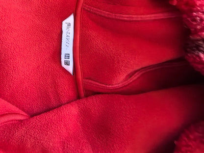 Uniqlo and JW Anderson label on red fleece