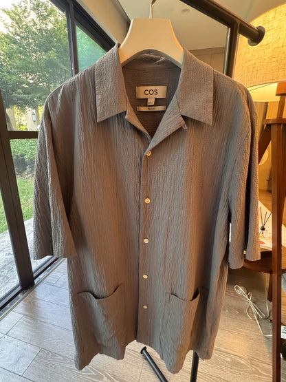 COS blue textured short-sleeve shirt on hanger