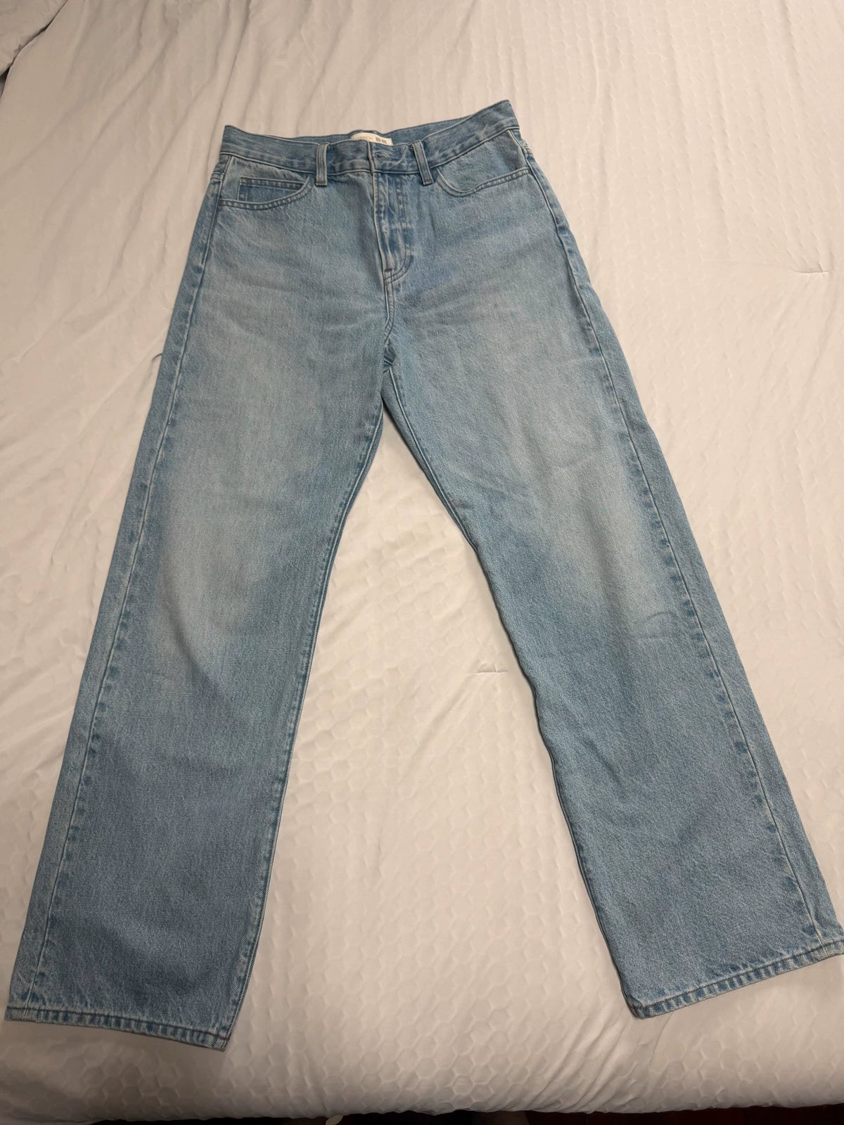 Uniqlo light blue straight-leg jeans, front view